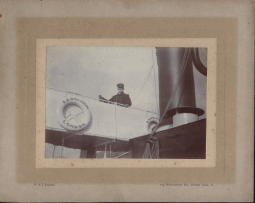 Click to enlarge: "The Admiral" on the bridge of the S.S. Dolphin.